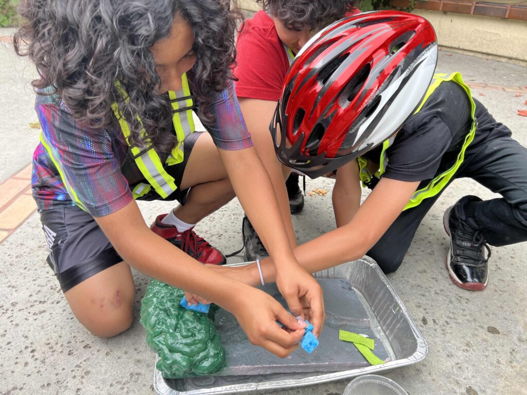 A photo of some of the students getting hands on with their learning building a model of what the LA River could look like